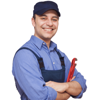 Man smiling in blue shirt, overalls and hat with arms crossed holding a red wrench