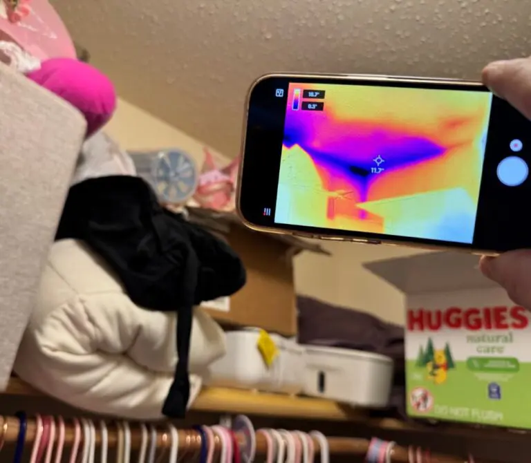 Thermal image camera showing dark blue spots in home indicating water damage